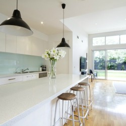 Designer kitchen and open plan living room with garden aspect